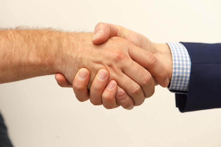 Academic partnership handshake